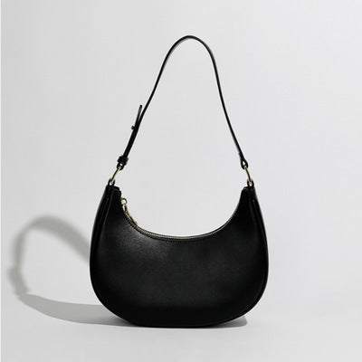 women's fashion with the underarm bag, also known as the one shoulder baguette bag or half moon bag